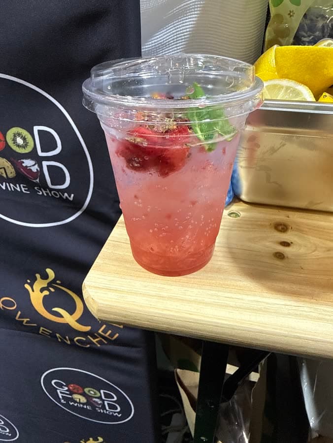 Berry mocktail with fresh garnish at the stand