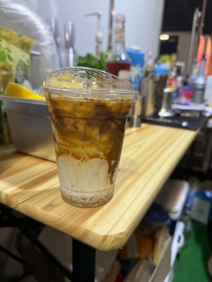 Layered iced latte on the prep bench